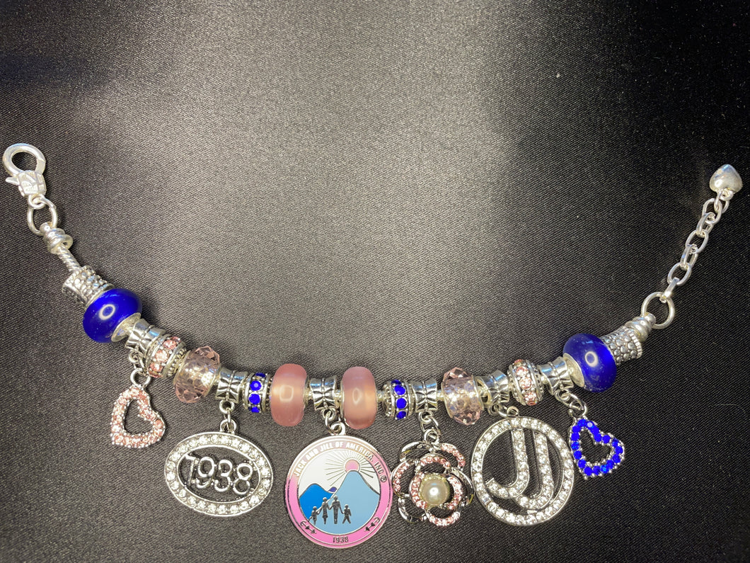 J & J silver toned charm bracelet